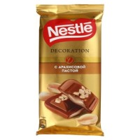 شکلات تیره شیری تزئین شده با کره بادام زمینی نستله 85 گرمی Nestle